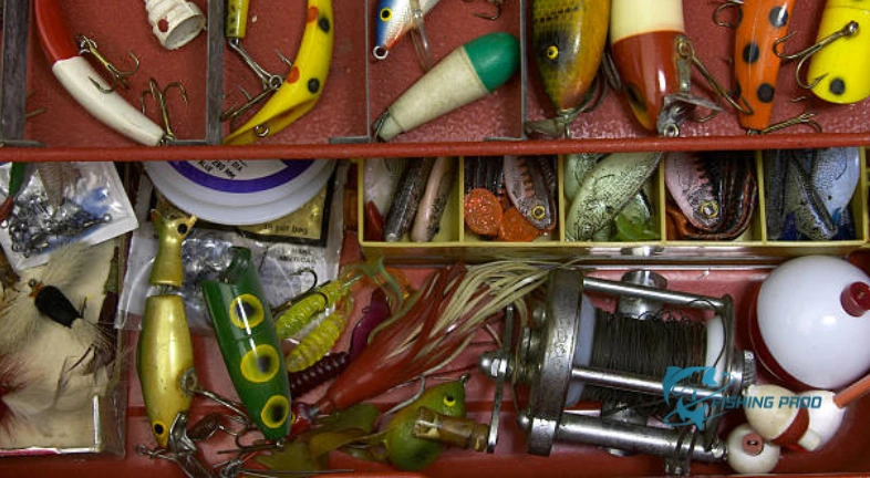 Colorful fishing lures organized in a red tackle box.
