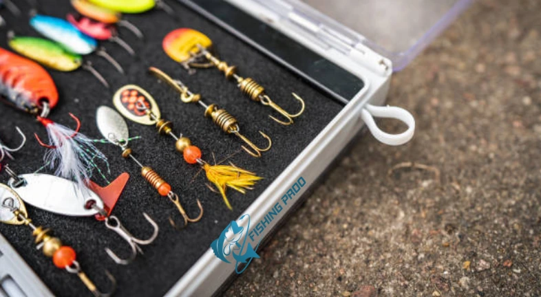 Diverse fishing lures and soft baits in a packed tackle tray.