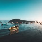 Many fishing boats on the water in the sea with beautiful clear blue sky